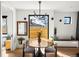 Bright dining room featuring a modern lighting fixture and beautiful backyard views at 1763 S Williams St, Denver, CO 80210