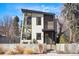 Modern two-story home featuring a unique architectural design with large windows and professional landscaping at 1763 S Williams St, Denver, CO 80210