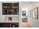 Hallway with built in dry bar and view to the window seat and stairs at 1763 S Williams St, Denver, CO 80210