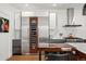 Stylish kitchen with stainless steel appliances, built-in wine cooler and breakfast bar at 1763 S Williams St, Denver, CO 80210