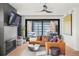 Cozy living room with a fireplace, plush seating, and sliding glass doors to the patio at 1763 S Williams St, Denver, CO 80210
