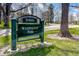 Close-up of Washington Park sign, showcasing the park's entrance with manicured grass and mature trees at 1763 S Williams St, Denver, CO 80210