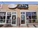 Exterior of Snarf's Sandwiches, a brick building with colorful signage, windows, and open/catering announcements at 1763 S Williams St, Denver, CO 80210