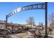 Street view under the 'South Pearl' sign featuring storefronts, pedestrian activity, and parked cars at 1763 S Williams St, Denver, CO 80210