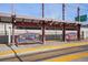 View of the University of Denver train station, featuring covered seating areas and signage for the RTD lines at 1763 S Williams St, Denver, CO 80210