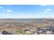 Expansive aerial view of the neighborhood, highlighting community layout and nearby lake at 17213 W 93Rd Pl, Arvada, CO 80007