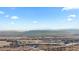 Panoramic aerial view showcasing the neighborhood, mountains, and surrounding landscape at 17213 W 93Rd Pl, Arvada, CO 80007