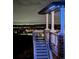 Back porch stairs with an impressive view of the city lights at night at 17213 W 93Rd Pl, Arvada, CO 80007