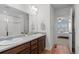 Bright bathroom with a double vanity, walk-in shower and tile flooring at 17213 W 93Rd Pl, Arvada, CO 80007