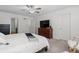 Bedroom with a ceiling fan, dresser, and neutral carpet at 17213 W 93Rd Pl, Arvada, CO 80007