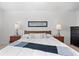 Bedroom featuring a queen sized bed and a framed painting above at 17213 W 93Rd Pl, Arvada, CO 80007