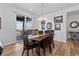 Bright dining room with wood floors, views of the mountain and outdoor patio at 17213 W 93Rd Pl, Arvada, CO 80007
