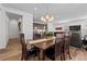 Inviting dining area connecting the kitchen and living room, perfect for entertaining at 17213 W 93Rd Pl, Arvada, CO 80007