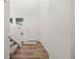 Inviting entryway with wood-look flooring, neutral walls, and natural light at 17213 W 93Rd Pl, Arvada, CO 80007