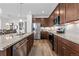 Modern kitchen with stainless steel appliances, granite countertops, and ample cabinet space at 17213 W 93Rd Pl, Arvada, CO 80007