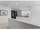 Bright loft area provides a tranquil seating area and an abundance of natural light and built-in bookcases at 17213 W 93Rd Pl, Arvada, CO 80007