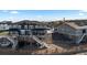 Stunning rear exterior showcasing a multi-level deck, fenced yard, and architectural design at 17213 W 93Rd Pl, Arvada, CO 80007