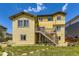 The spacious backyard features a large deck and lush lawn at 14074 Yellow Tip Dr, Parker, CO 80134