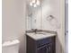 Half bathroom with granite countertop and single sink at 14074 Yellow Tip Dr, Parker, CO 80134