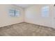 Neutral bedroom featuring neutral carpet, a window, and fresh white paint at 14074 Yellow Tip Dr, Parker, CO 80134