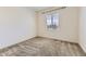 Neutral bedroom featuring neutral carpet, a window, and fresh white paint at 14074 Yellow Tip Dr, Parker, CO 80134