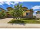 Charming home with a well-manicured lawn and mature trees, creating inviting curb appeal at 14074 Yellow Tip Dr, Parker, CO 80134