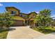 Two-story home featuring a two-car garage, landscaped yard and appealing architecture at 14074 Yellow Tip Dr, Parker, CO 80134