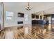 Spacious open-concept layout with fireplace, hardwood flooring, and an airy feel that seamlessly flows into the kitchen at 14074 Yellow Tip Dr, Parker, CO 80134