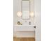 Elegant powder room with floating vanity, quartz countertop and modern lighting at 535 Albion St, Denver, CO 80220