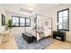 Modern bedroom boasts a four poster bed, patterned rug, stylish decor, and tray ceiling at 535 Albion St, Denver, CO 80220