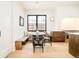 Eat-in kitchen area features natural light from window, built-in bench, and modern seating at 535 Albion St, Denver, CO 80220