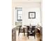 Eat-in kitchen area features natural light, built-in bench, and modern black chairs at 535 Albion St, Denver, CO 80220