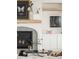 Close up of the modern fireplace with decor and built-in shelves at 535 Albion St, Denver, CO 80220