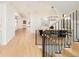 A modern foyer offers a view of the stairway, dining room, and living room and wood floors at 535 Albion St, Denver, CO 80220