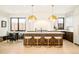 Gourmet kitchen with large island, pendant lighting, and stainless steel appliances at 535 Albion St, Denver, CO 80220