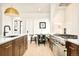 Bright eat-in kitchen area features stainless steel appliances, gas range, and custom cabinetry at 535 Albion St, Denver, CO 80220