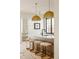 Kitchen featuring a large island with seating and designer pendant lighting at 535 Albion St, Denver, CO 80220
