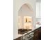 Modern kitchen features decorative shelving built into arched nook and stainless steel stove at 535 Albion St, Denver, CO 80220
