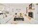 Bright open-concept living room featuring a modern fireplace and hardwood floors at 535 Albion St, Denver, CO 80220