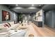 Modern living room featuring neutral decor, recessed lighting, light wood floors and an accent wall at 535 Albion St, Denver, CO 80220