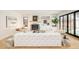 Open living room with modern furniture, fireplace and view of backyard at 535 Albion St, Denver, CO 80220
