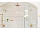 Bright, modern shower with double shower heads, glass enclosure and tiled walls at 535 Albion St, Denver, CO 80220