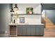 Modern wet bar featuring a beverage cooler, white countertops, subway tile backsplash and decorative accents at 535 Albion St, Denver, CO 80220