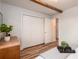 Bedroom showcasing a spacious closet and wood flooring with neutral tones at 207 S Quicksilver Ave, Castle Rock, CO 80104