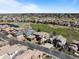 An aerial view showcasing a beautiful neighborhood, a golf course, and lush green space at 9099 E Harvard Ave, Denver, CO 80231