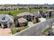 A grand two-story home with a tile roof is situated on a corner lot near a lush green space at 9099 E Harvard Ave, Denver, CO 80231