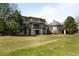 Gorgeous backyard featuring well-manicured lawn, framed by luxurious houses at 9099 E Harvard Ave, Denver, CO 80231