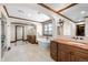Elegant bathroom featuring wood trim, tile flooring, soaking tub, and expansive vanity at 9099 E Harvard Ave, Denver, CO 80231