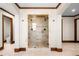 The pristine bathroom includes dual shower heads, tile flooring, and glass door at 9099 E Harvard Ave, Denver, CO 80231