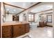 The expansive bathroom is equipped with soaking tub, vanity, walk-in closet, and tile flooring at 9099 E Harvard Ave, Denver, CO 80231